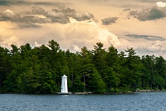Sun Breaking Through Clouds Over Herrick Cove Light
